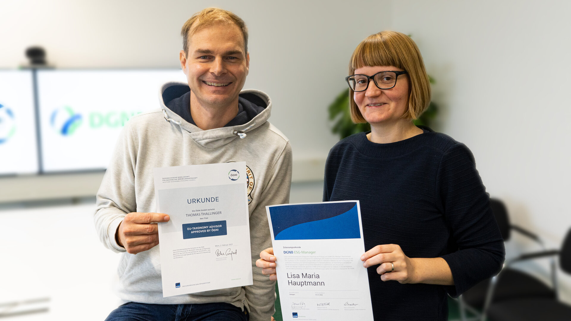 Colleagues with their certificates